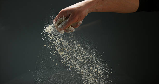 istock Hands of Man with Flour against black background 1688324780