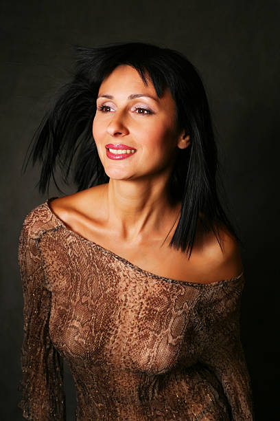 face romantic woman with a butterfly on her neck in an isolated white background