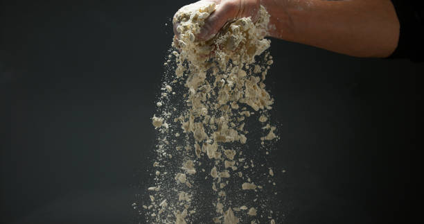 istock Hands of Man with Flour against black background 1688326976