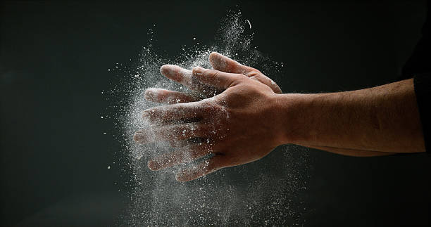 istock Hands of Man with Flour against black background 1688327527