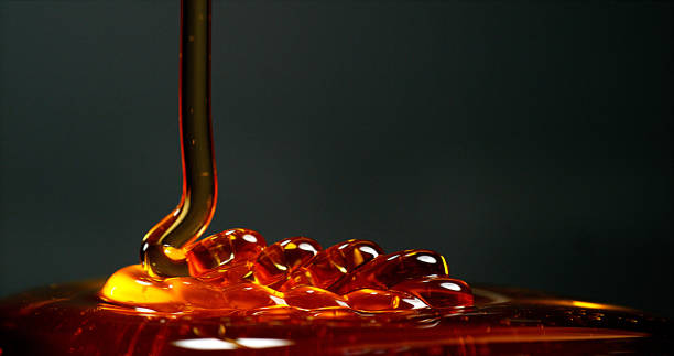istock Honey Flowing against Black Background 1688329920