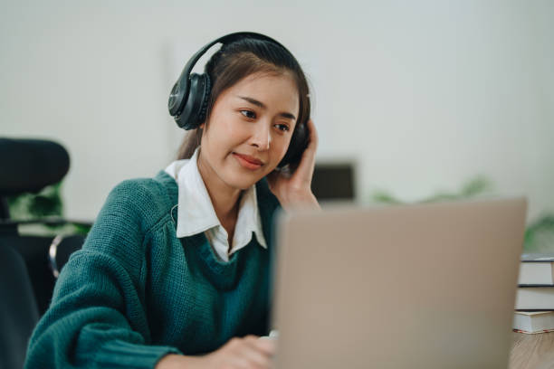 istock Studying online, beautiful Asian female student or student studying online at home 1688339266