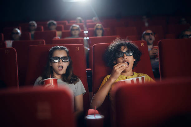 watching 3d cartoon in cinema! - audience surprise movie theater shock imagens e fotografias de stock