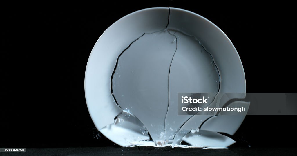 Plate Falling And Exploding On Black Background Stock Photo - Download ...