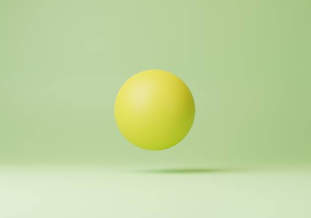 istock 3d yellow ball on green background 1688353282