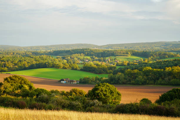 istock Looking at a sunset on countryside and farm fields 1688356087