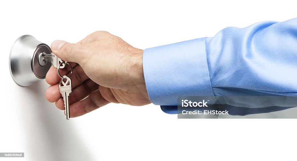 Man Opening Deadbolt Lock with Keys Isolated on White Background Key Stock Photo