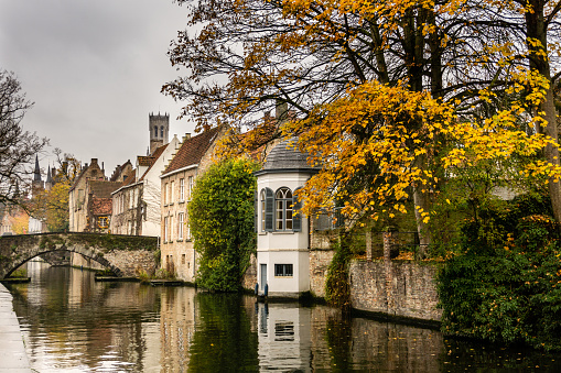 Casual spot in along the canal of Bruges during the foliage in month of November - Belgium