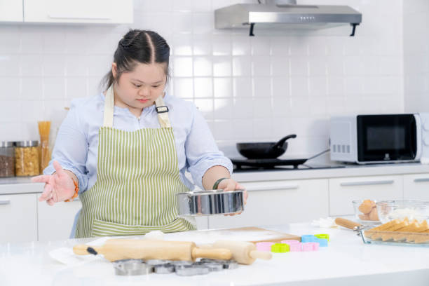 istock Young Asian girl doing bakery in kitchen 1688371935