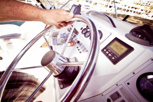 Man Steering a Boat close up shot