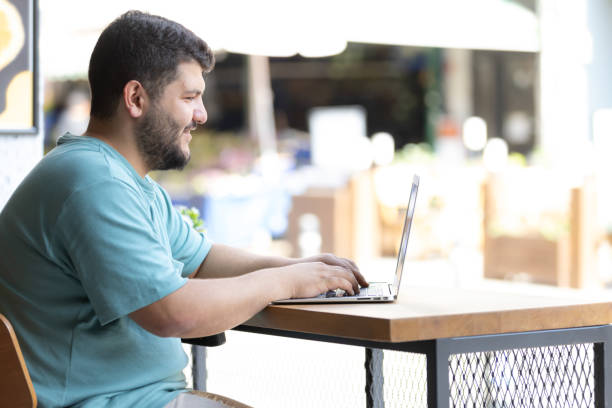istock Plus sized young man is working on the outside. 1688400980