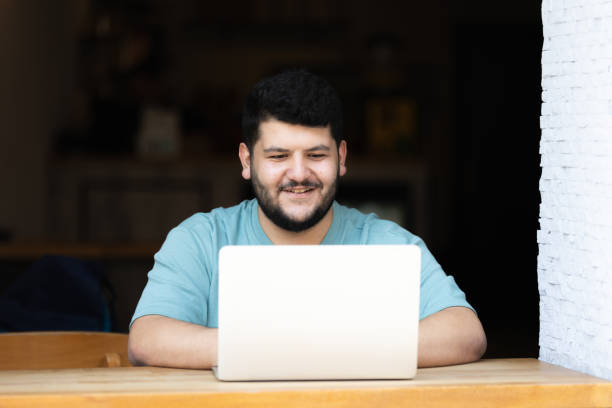 istock Plus sized young man is working on the outside. 1688402165