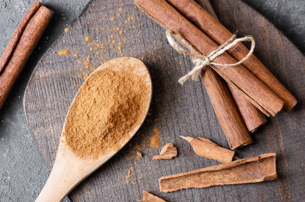 istock Cinnamon sticks and cinnamon powder on rustic background, healthy spice, (Cinnamomum) 1688414110