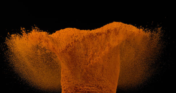 istock Turmeric, curcuma longa, Powder falling against Black Background, Indian Spice 1688419910
