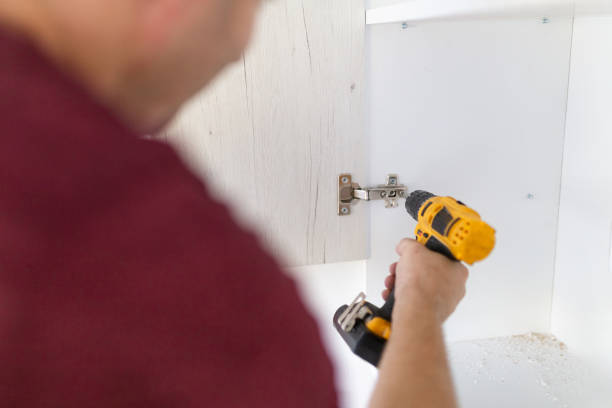 istock Carpenter process of wood door hinge installation 1688430703
