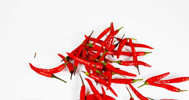 istock Red Chili Peppers, capsicum annuum falling against With Background 1688435156