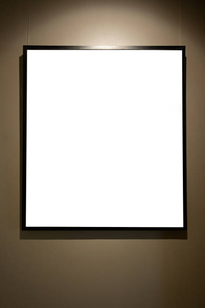 istock Blank picture frames on brown wall with glowing lamp, mock up 1688462368