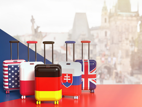 The main tourists in the Czech Republic. Suitcases with flags of countries visiting the Czechia. 3D illustration on the theme of tourism.