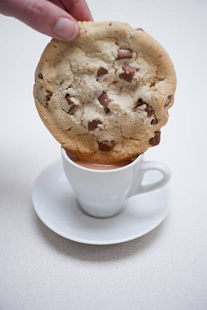 https://media.istockphoto.com/id/168848954/photo/hand-dipping-large-chocolate-chip-cookie-in-small-coffee-cup.jpg?s=612x612&w=0&k=20&c=ve-Zp0FKO7WsFZEd1Z2Lbbl6I9GOjAJvjllIxLGhDB8=