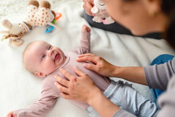 istock Cheerful mom and daughter cuddling at home 1688494027
