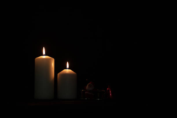 istock Burning candles and christmas decorations. 1688496802