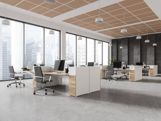 istock Stylish coworking interior with pc desktop and armchairs in row, window 1688506047