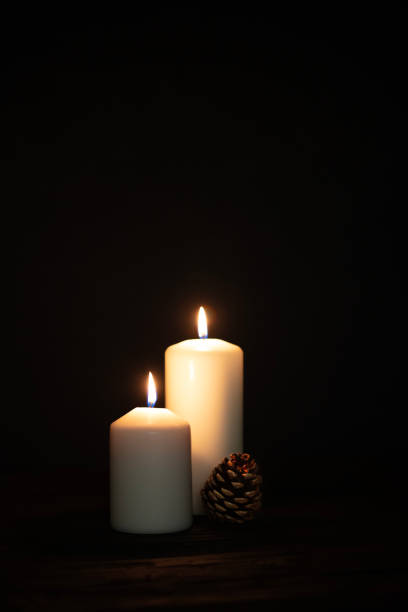 istock Burning candles and christmas decorations. 1688506581