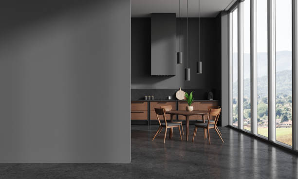 istock Grey home kitchen interior with cooking and dining area, window and mockup wall 1688512808