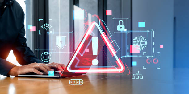 istock Hands typing on laptop with cybersecurity alert screen 1688515956