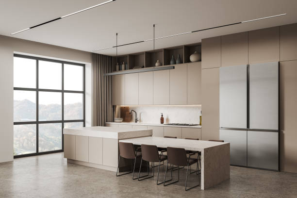 istock Beige kitchen interior with bar island and cooking space with panoramic window 1688516011