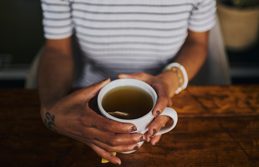 female hands holding a cup of herbal tea, stock photo, copy space, stock photo, copy space