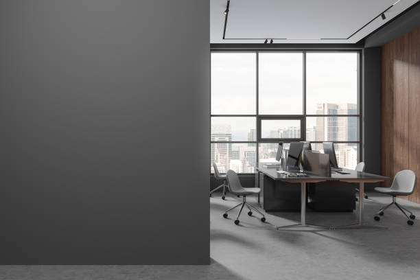 istock Gray and wooden open space office interior with blank wall 1688525266