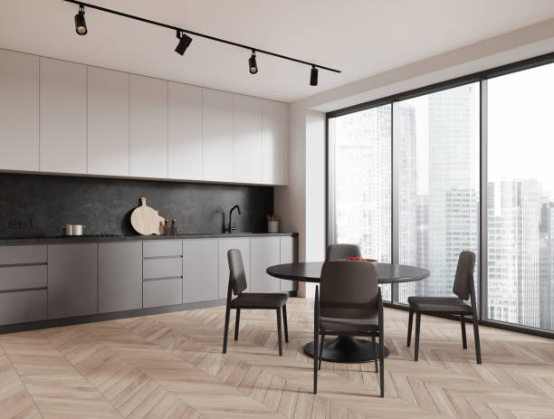 istock Stylish home kitchen interior with eating and cooking space, panoramic window 1688532849