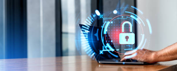 istock Man hands typing on laptop in office with lock cybersecurity hologram 1688533311
