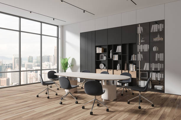 istock Modern business room interior with board and shelf with decoration, window 1688539916