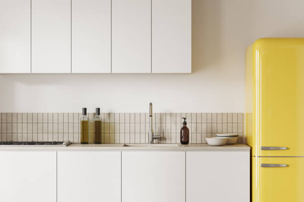 istock Stylish home kitchen interior with fridge and cooking space with kitchenware 1688540455