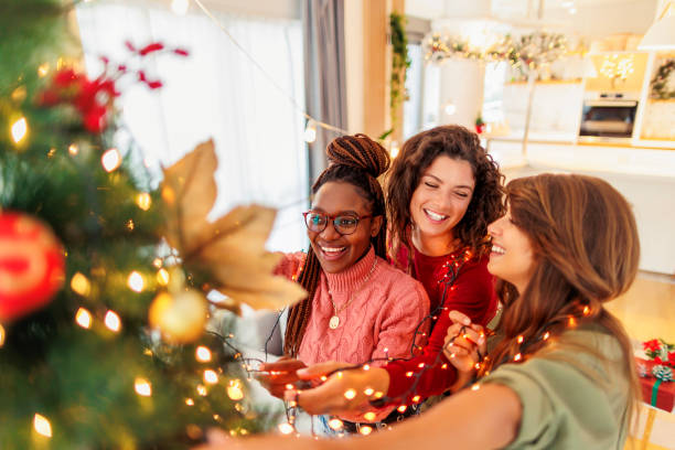 istock Girls decorating Christmas tree 1688540982