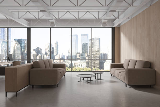 istock Business office interior lounge zone with coffee table near panoramic window 1688541345