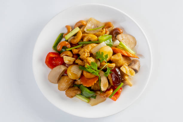 bowl with Sri Lankan cashew nuts fried homemade and spiced with curry leaves, garlic, chili and masala spices