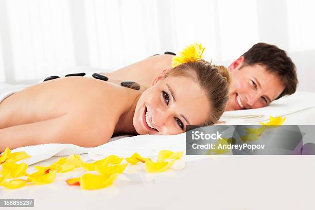 Couple Having A Hot Stone Massage Stock Photo - Download Image Now - Adult, Adults Only, Alternative Therapy