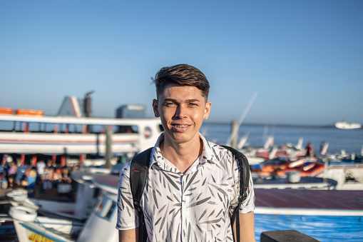 Portrait of caucasian tourist in passenger seaport. Cotejuba - Belém - Pará - Brazil