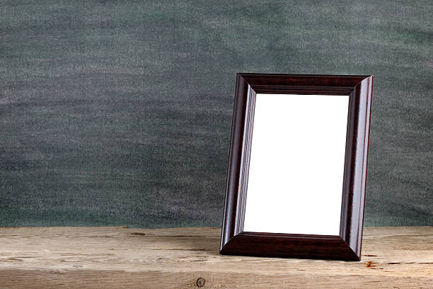 istock Old photo frame on wooden table 168855999