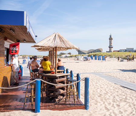 Rostock Warnemünde, Mecklenburg-Western Pomerania, Germany - September 9, 2023: Beach bar on Warnemünde beach in the day in summer.