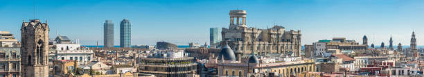 Barcelona rooftop panorama towers and spires Spain Sweeping panoramic view over the rooftops and rotundas, spires and skyscrapers of Barcelona, from the medieval bell towers in the Gothic Quarter past the Torre Mapfre and Hotel Arts skyscrapers overlooking the blue Mediterranean Sea to the crowded cityscape of central Barcelona around La Rambla, Catalonia, Spain. ProPhoto RGB profile for maximum color fidelity and gamut. barcelona skyline stock pictures, royalty-free photos & images