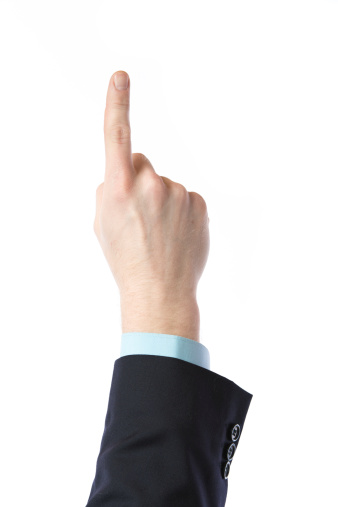 Businessman's hand pointing on something.