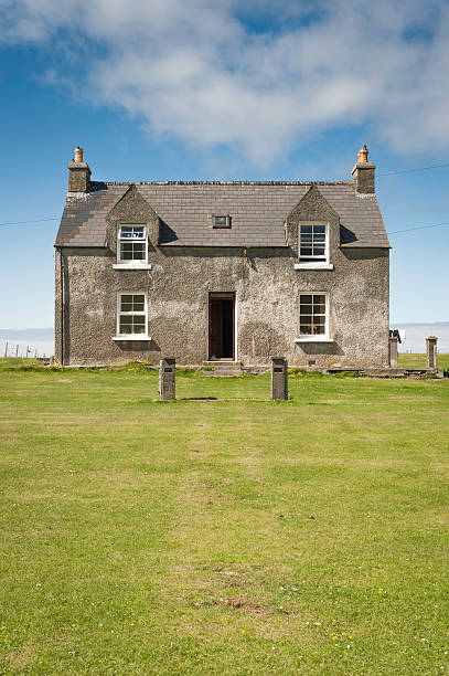 A cottage on a meadow in Southern England.
