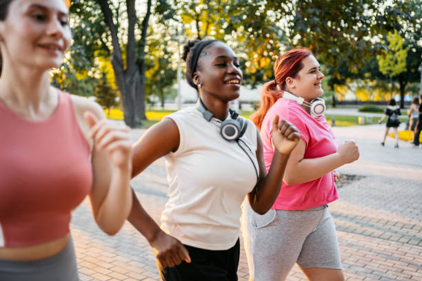 istock Three Young Female Friends Jogging In The Park 1688572284