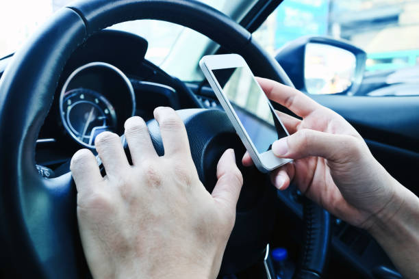 istock image of using a mobile phone inside of a car 1688574553