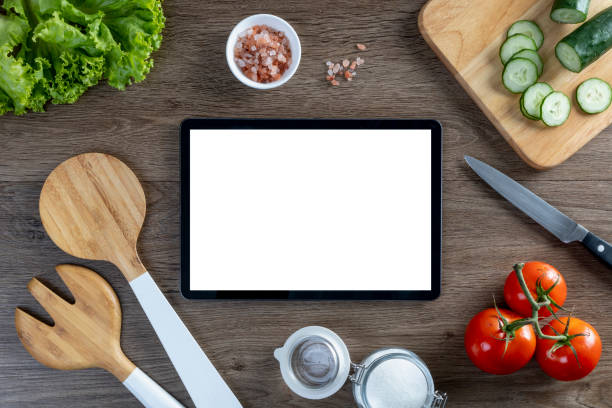 istock Vegetables on wooden table, background, salad concept, top view, tablet 1688579995