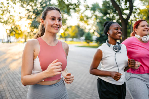 istock Three Young Female Friends Jogging In The Park 1688579997